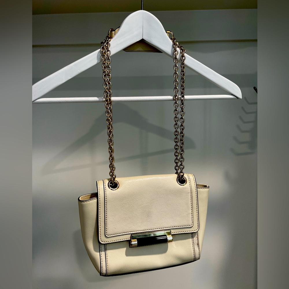 Diane von Furstenberg bag. Off- white leather with gold hardware and chain.